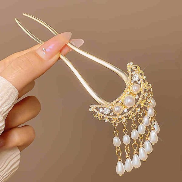 20. Pearl crescent pendant