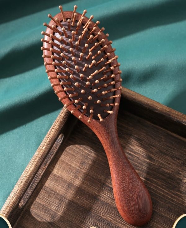 Golden sandalwood hair brush.