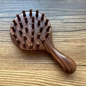 Rosewood tooth shaping massage comb.